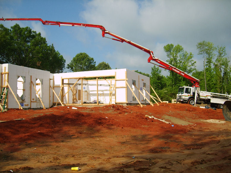 Extended boom concrete pump